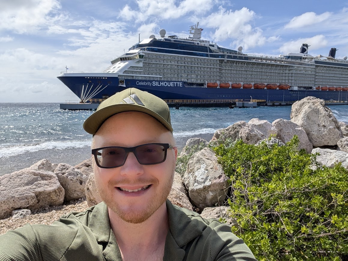Steven with a Celebrity cruise ship behind him